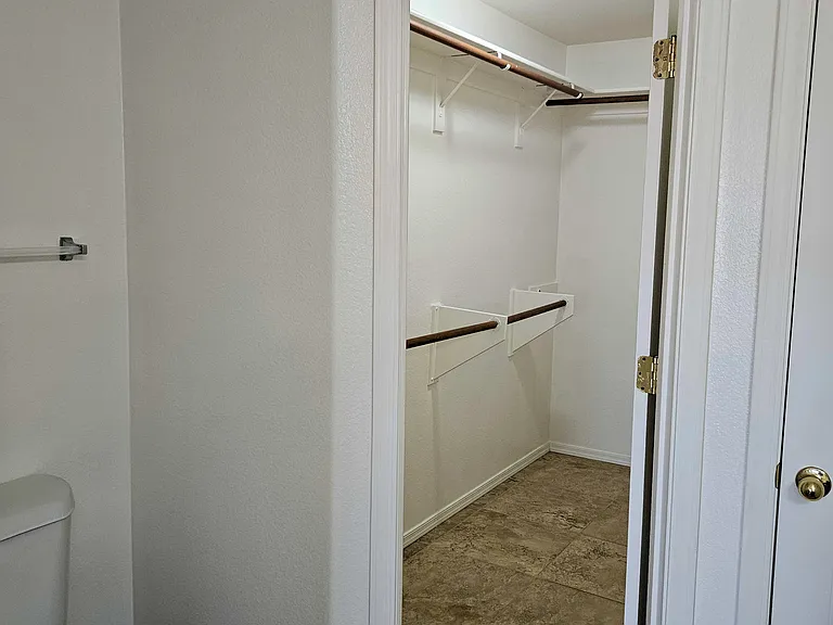 Walk in closet in primary bedroom