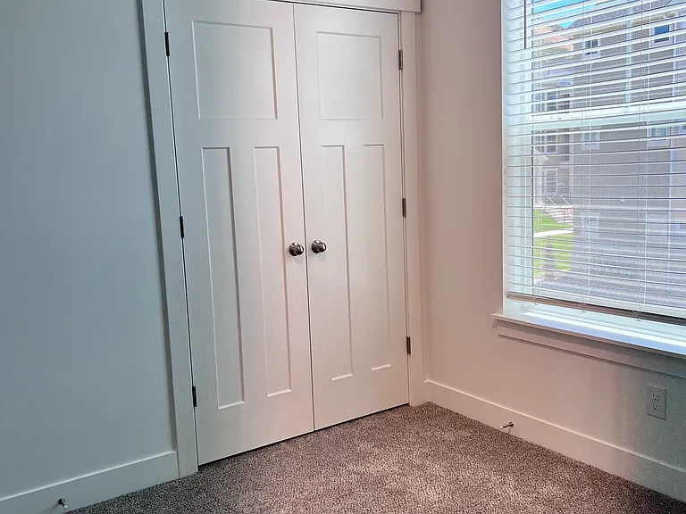 Second bedroom with closet with french doors