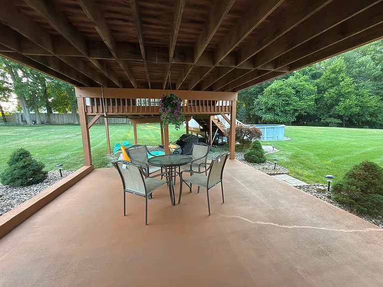Lots of patio/outdoor seating areas, gas grill, huge yard, private above-ground pool