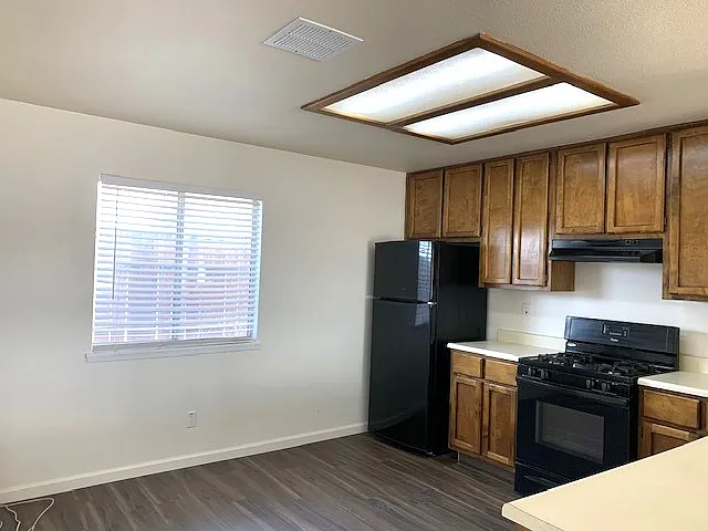 Bright and spacious dine-in kitchen with all major appliances and ample storage.