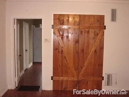 Living Room : Living area with wood floors and large closet