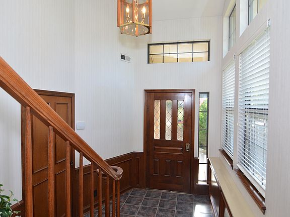 Tiled Entryway with High Ceilings