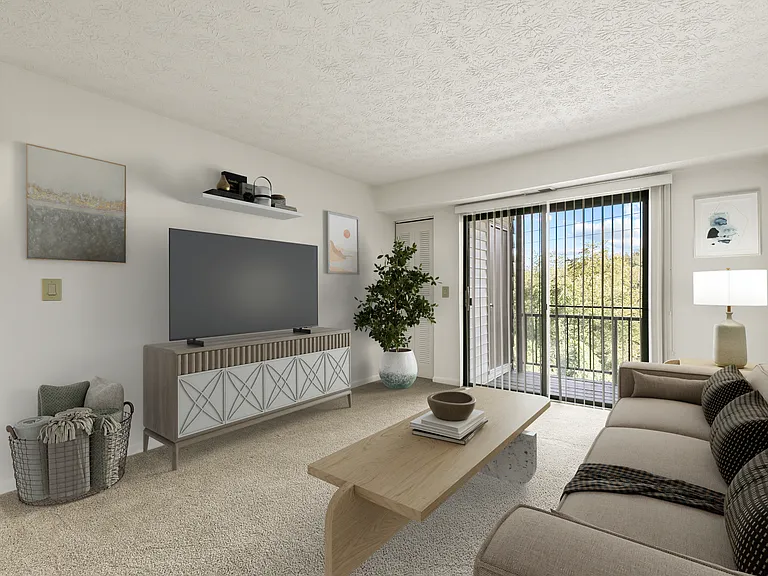 Spacious Living Room with Sliding Glass Doors Leading to Private Patio (shown here with model furniture)