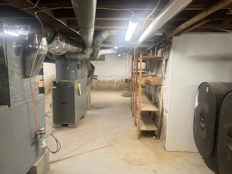 Basement Storage area for Unit 1. Mechanicals for both units are also located here, and laundry machines for Unit 1 (not pictured).