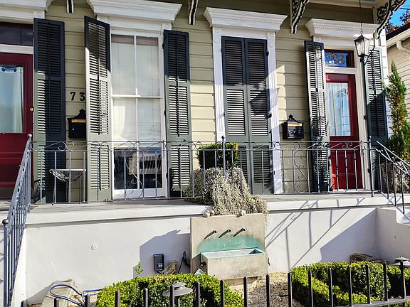 Porch, fountain, and garden