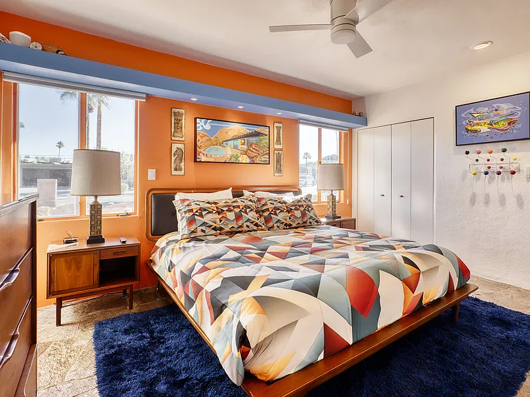 Master bedroom with two designer closets.