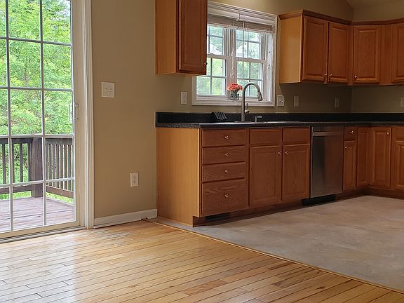 Kitchen conveniently located adjacent to Dining with access to rear deck