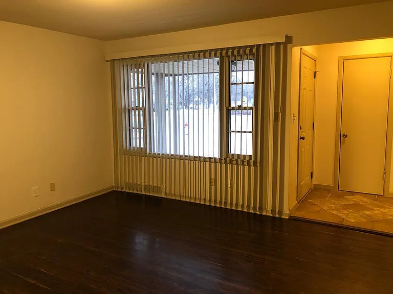 spacious living room with wood floors