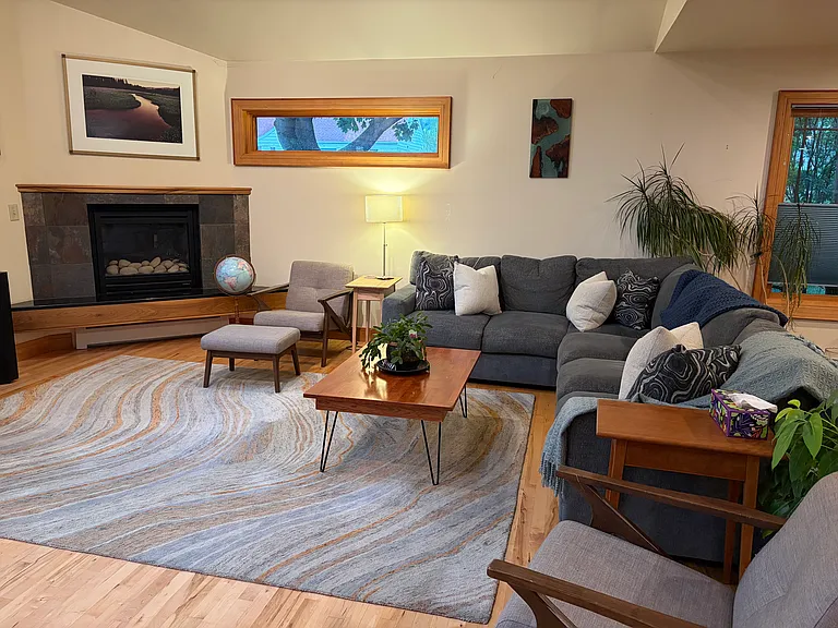 Furnished living room, vaulted ceilings and gas fireplace.