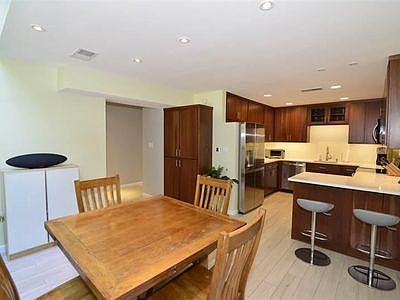 Two dining areas. Counter area and dining room. Nice big pantry against the wall by the fridge.