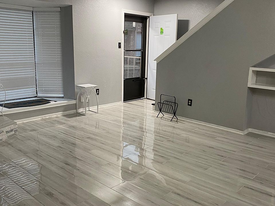 Entrance door to the living room and second floor leading to the two bedrooms.