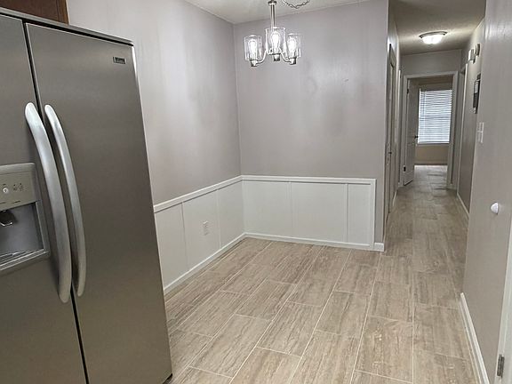 View of Dining area and from kitchen and down the hall are the two bedrooms, a hall bathroom and the laundry.