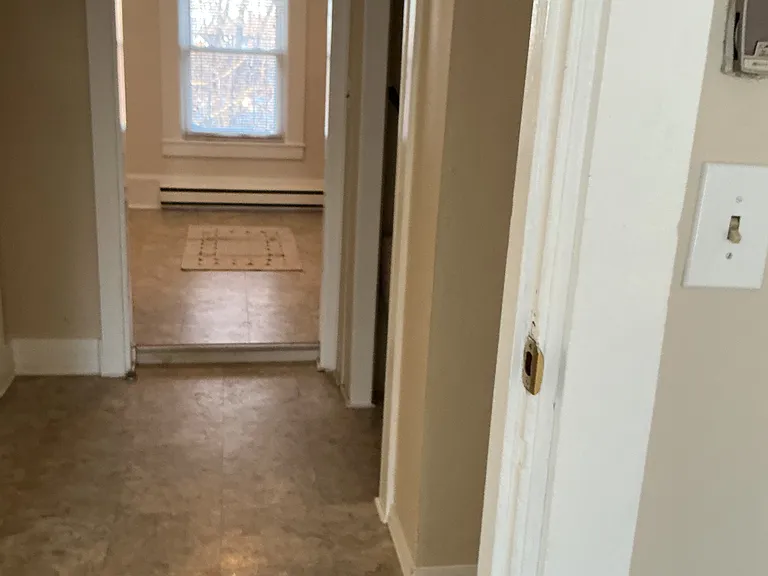 Hallway between kitchen and living room.
