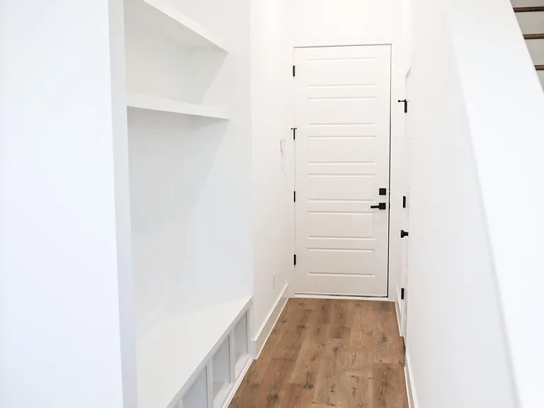 First floor foyer and mudroom storage.