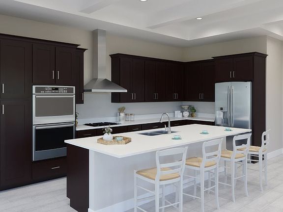The spacious kitchen features extensive quartz countertops as well as a convenient center island in