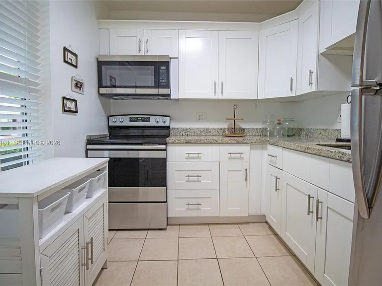 6020 NW 64th Ave #108 — Photo 1
