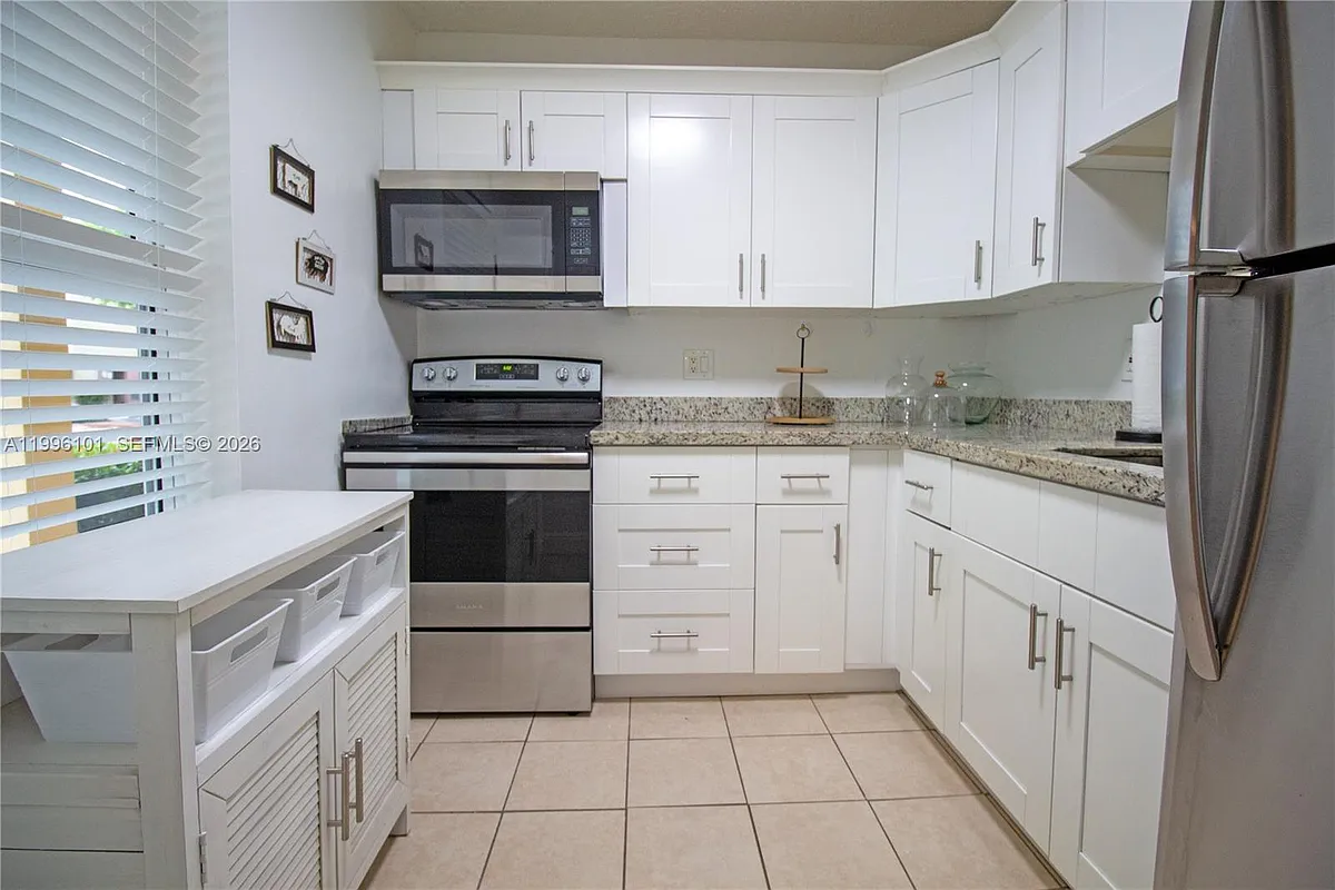 Photo 2 of 19 - 6020 NW 64th Ave #108 - Tamarac, FL Building Photo - 6020 NW 64th Ave #108