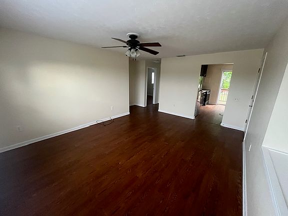 Spacious living room that fits large sectional. Point of view from the front corner.