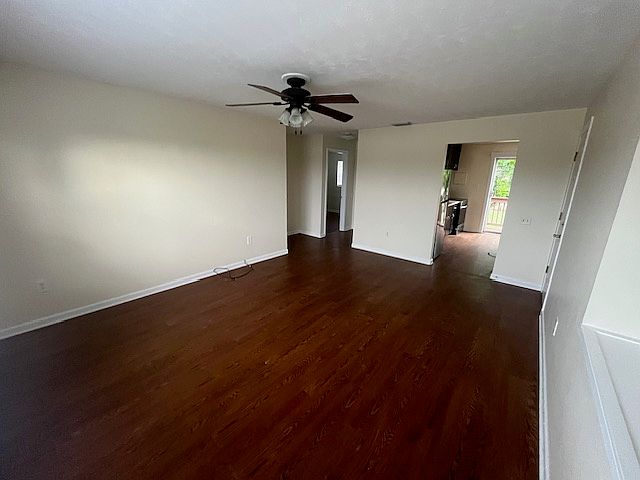 Spacious living room that fits large sectional. Point of view from the front corner.