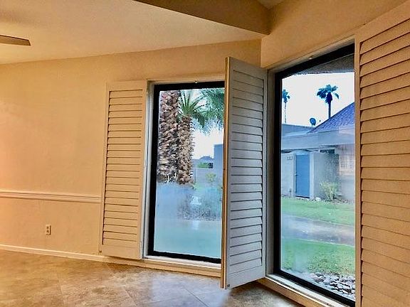 Plantation Shutter on floor to ceiling windows!