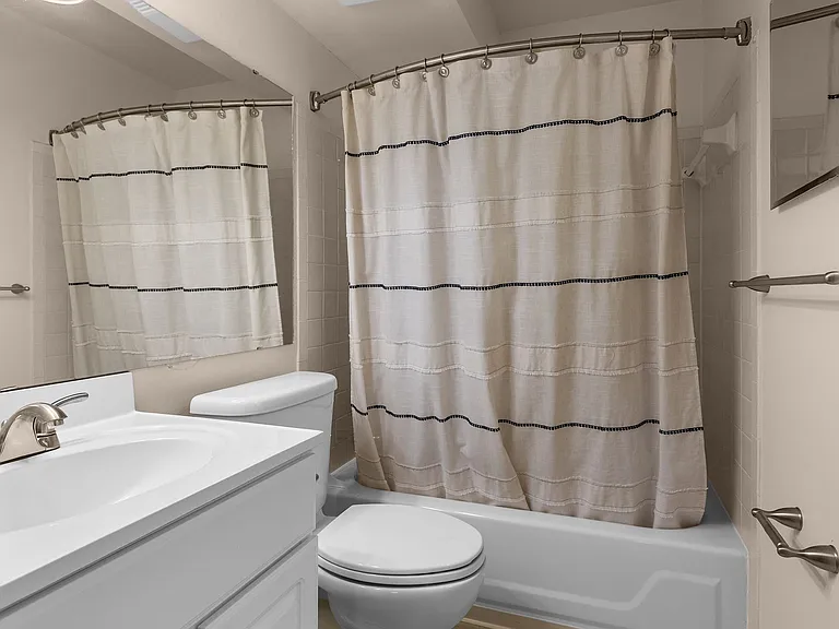 Bowed-Out Shower Curtains for More Space