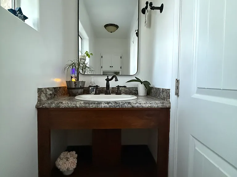 First level bathroom sink and toilet.