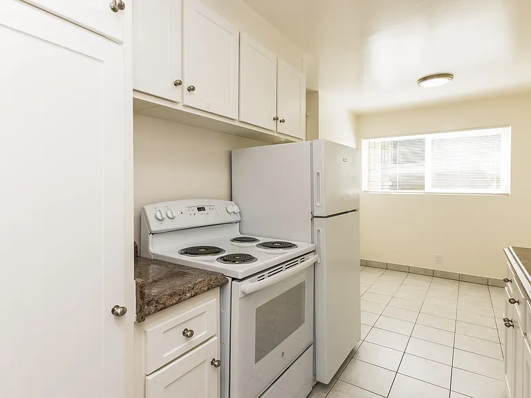KITCHEN - Angle #2
* This is a typical apartment. Some features may vary from apartment to apartment such as the counter tops and tile colors, etc. but most will be nutral colors.