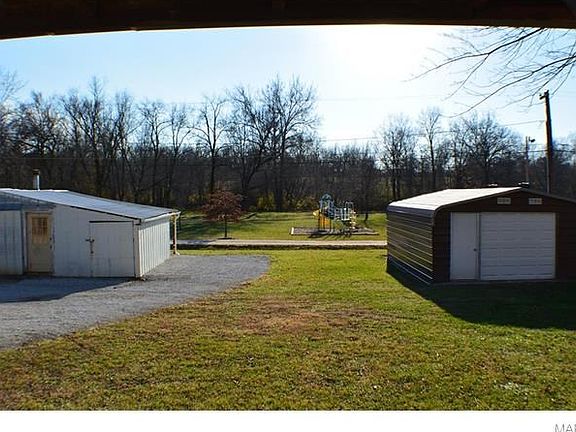Watch the kids on the parks playground from the covered porch or kitchen window