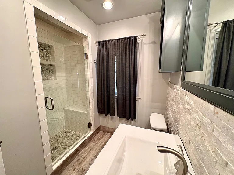 Guest bathroom with spa shower.