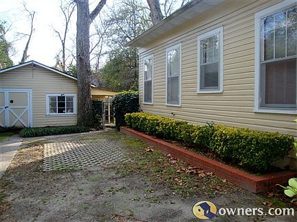 Left side of house from screened-in porch