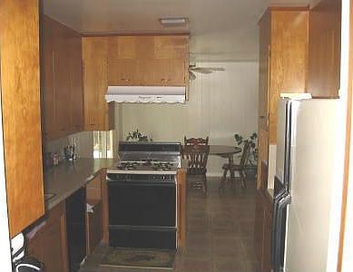 Kitchen (12.5 x 9.5), dining room (9.5 x 9.5) from laundry room (9.5 x 5.5)