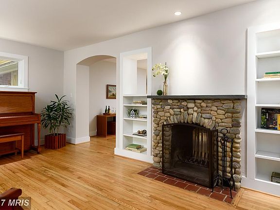 Handcrafted River Rock Fireplace and Built-Ins