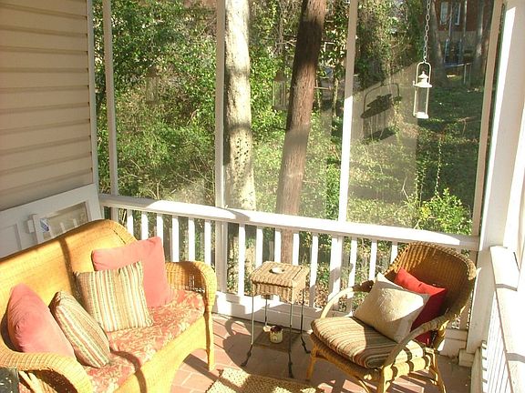 Comfy Sunroom Screened in with a Great View.