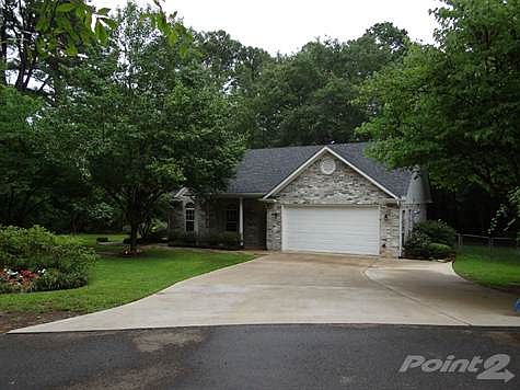 Immaculate home nestled in the woods.