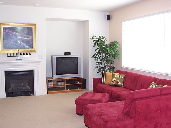 family room w/ fireplace, recessed lights, entertainment center
