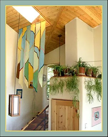 Stairway to level 4. Washer/dryer closet and whole house heat re-circulation chimney. Pine T&G ceiling planes with skylights. Every room is 100% naturally daylit!