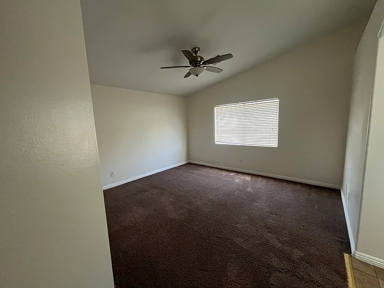 Primary bedroom with Ceiling fan