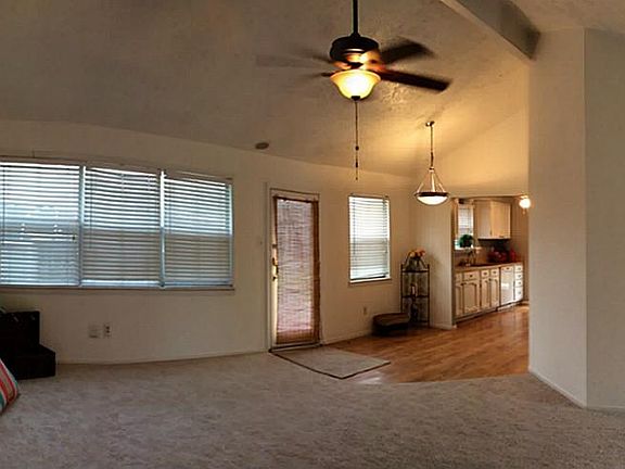 Full view of living room to dining and kitchen