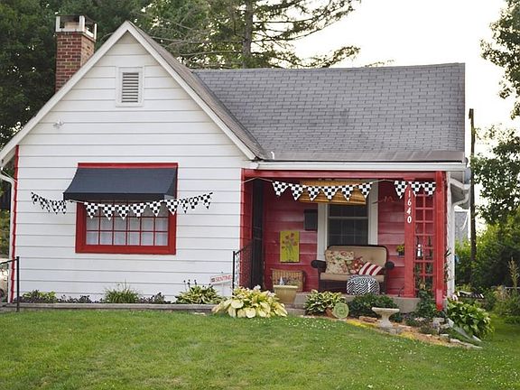 Nice covered porch to enjoy lovely neighborhood. New windows & exterior screened doors.