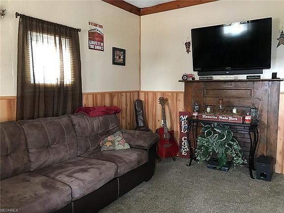 Living Room with decorative fireplace ...