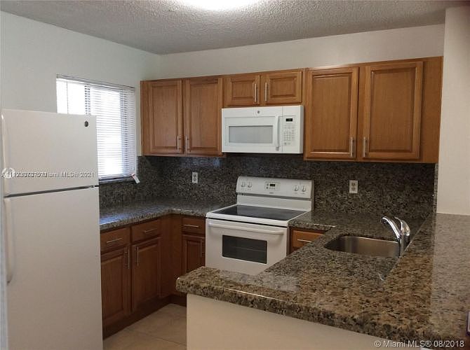 1st image of 8750 N Sherman Cir APT 104