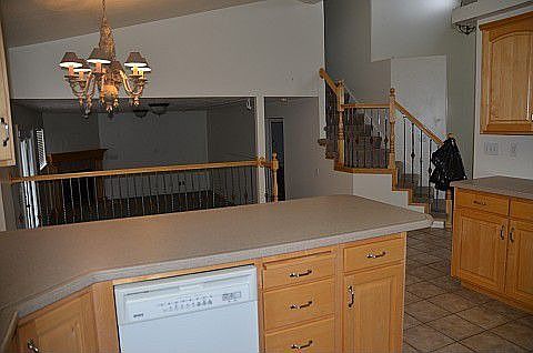 Family room, dinning room, stair case, & Kitchen from Kitchen