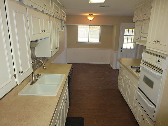 Kitchen with gas cooking.