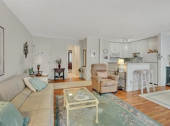 Gleaming hardwood flooring accent this home.  Spacious living room opens to dining room and kitchen.