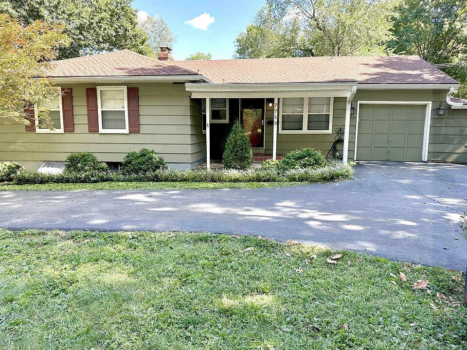 Exterior street view with u-shaped driveway