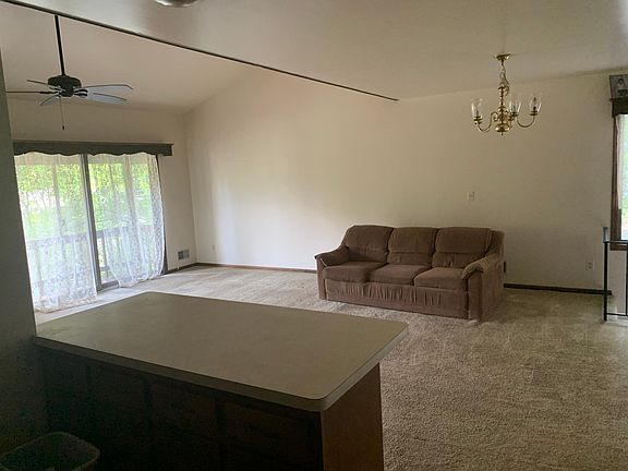 View from the kitchen of the dining room area (we usually put a table under the chandelier). This area is about 14x14. On the left is a sliding-glass door that leads to a deck in the front of the house, facing the Delaware River. (Yes, the couch will be
