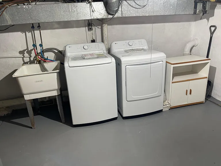 basement with LG brand new washer/dryer