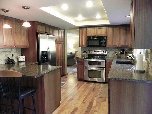 Complete kitchen renovation features new cabinets w/pull out panty, slab granite counters & stainless appliances. Tasteful and functional design!