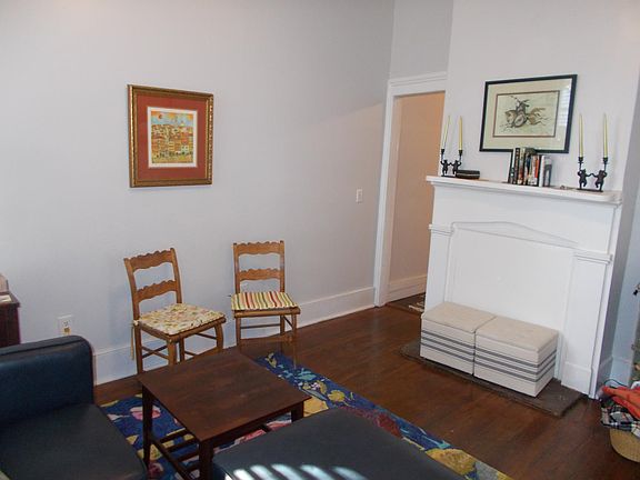 TV to right, not in photo. Reading chair now located where the two small chairs are pictured.