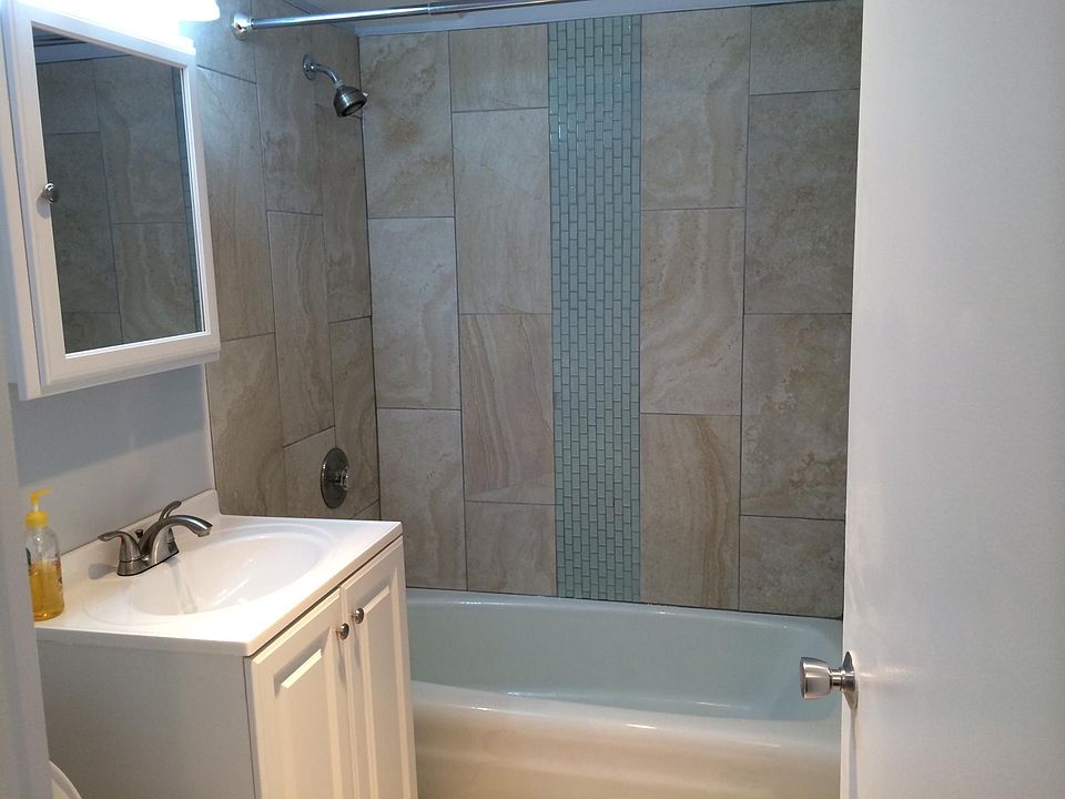 Bathroom with glass and ceramic tile